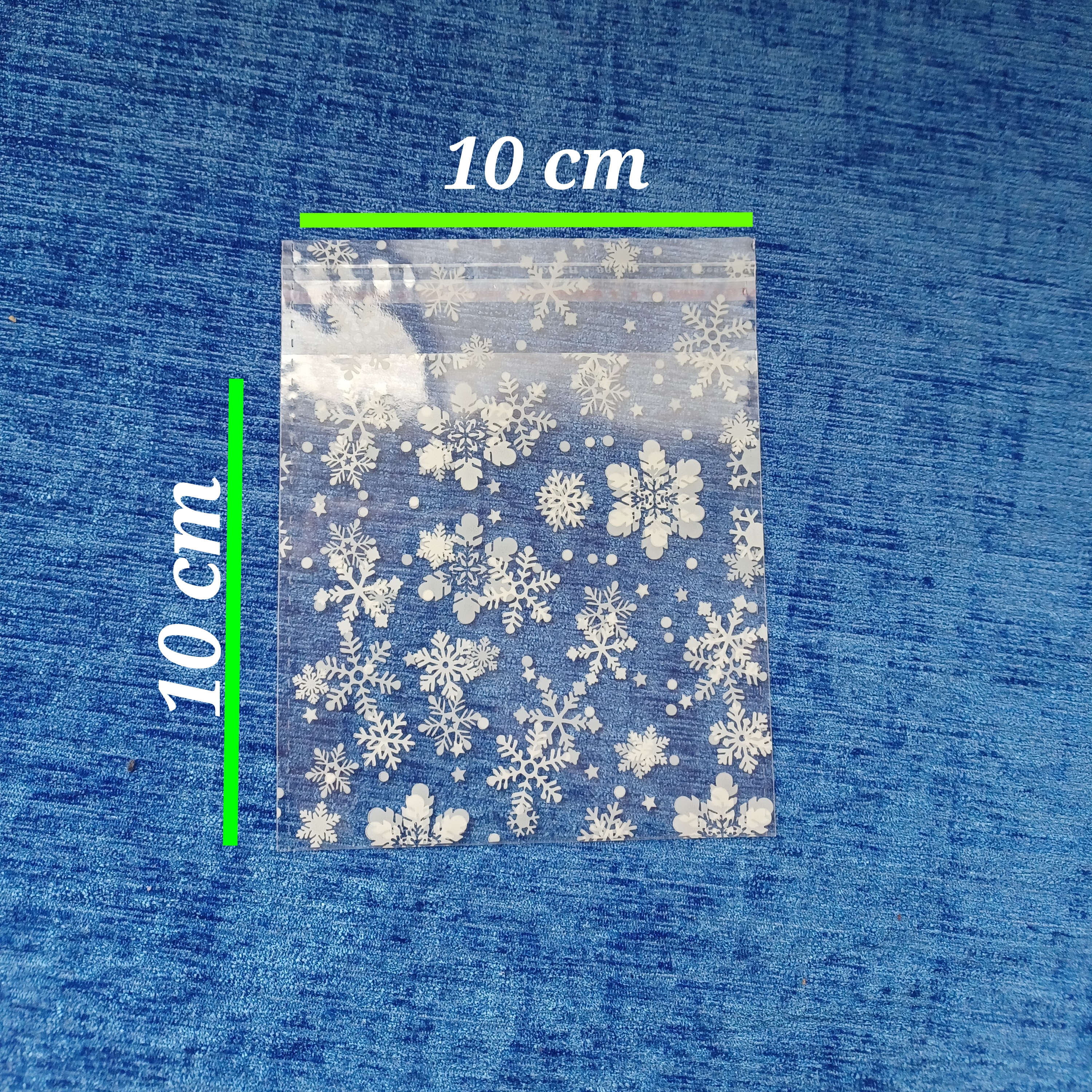 یک بسته 5۰ عددی سایز 10x10 سلفون لبه چسبدار طرح برفی